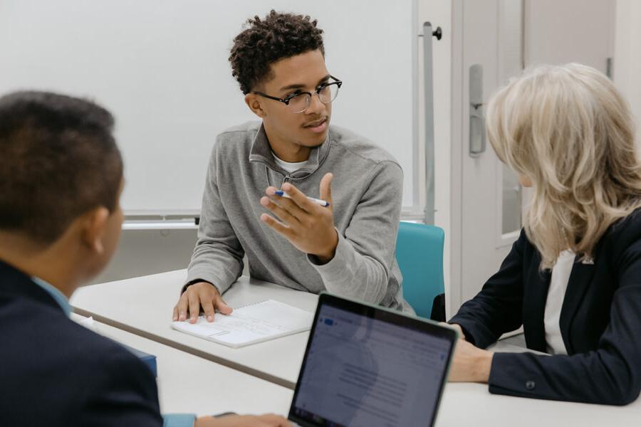 Students from the business data analytics program engage in a classroom discussion.